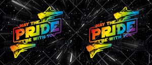Deux vaisseaux spatiaux aux couleurs de l'arc-en-ciel avec le texte "May the Pride Be With You" apparaissent sur un fond étoilé à thème spatial, célébrant la fierté LGBTQIA+ avec des traînées de lumière vibrantes.